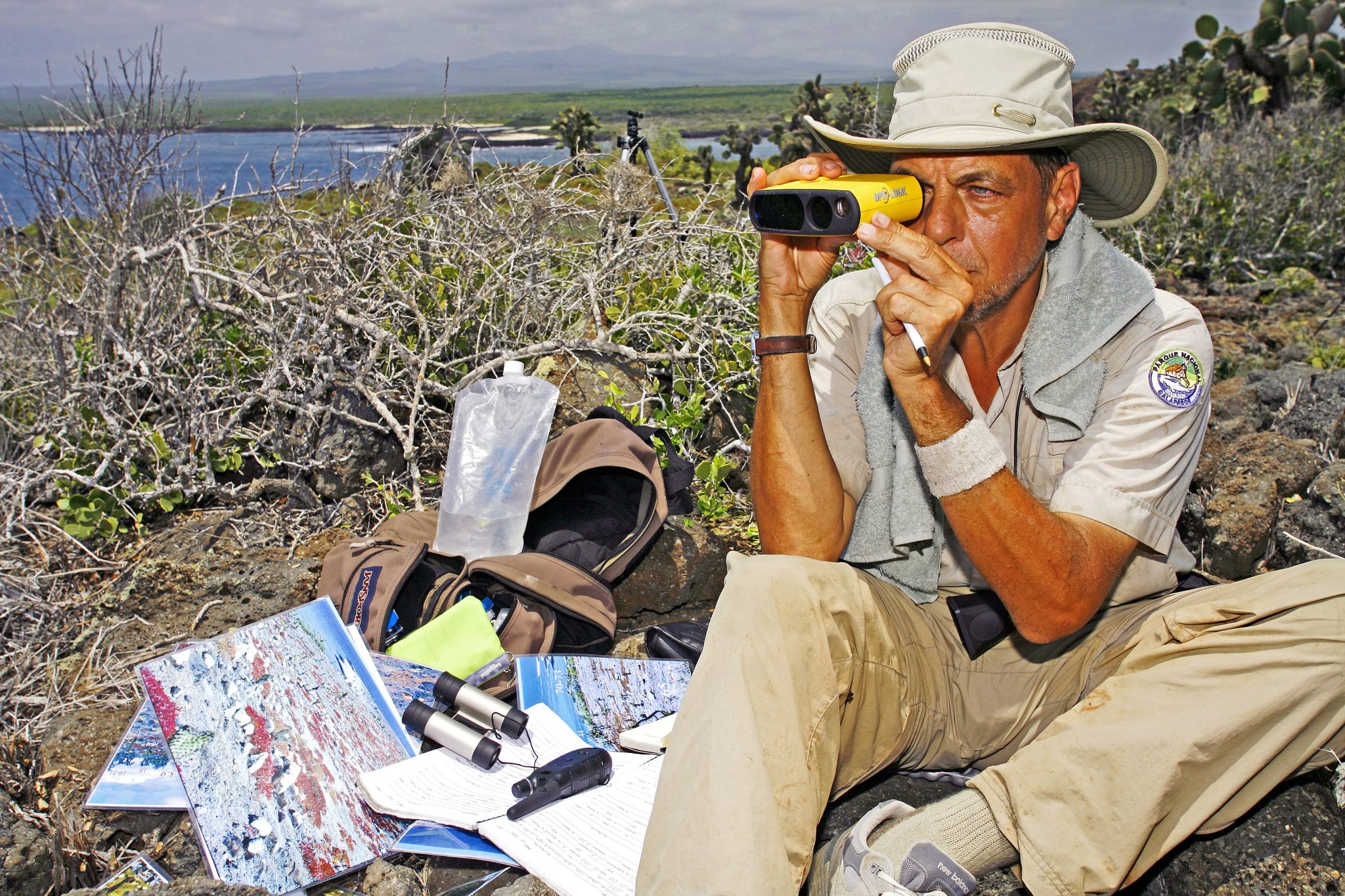 It is possible to measure the size or height of an object in an old photograph if one (1) knows the distance of the object from the camera and (2) if one also knows the size of any other object in the image.  Using a laser hypsometer (which I am holding here in this photograph), my research team and I were able to reconstruct the age distribution of tree Opuntia on South Plaza fifty years ago and to show how this distribution had been transformed by an increasingly aging population over time.